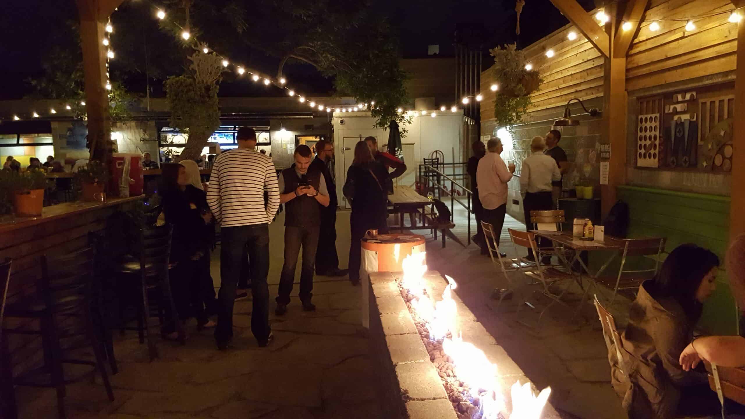 people mingling in outdoor reastaurant